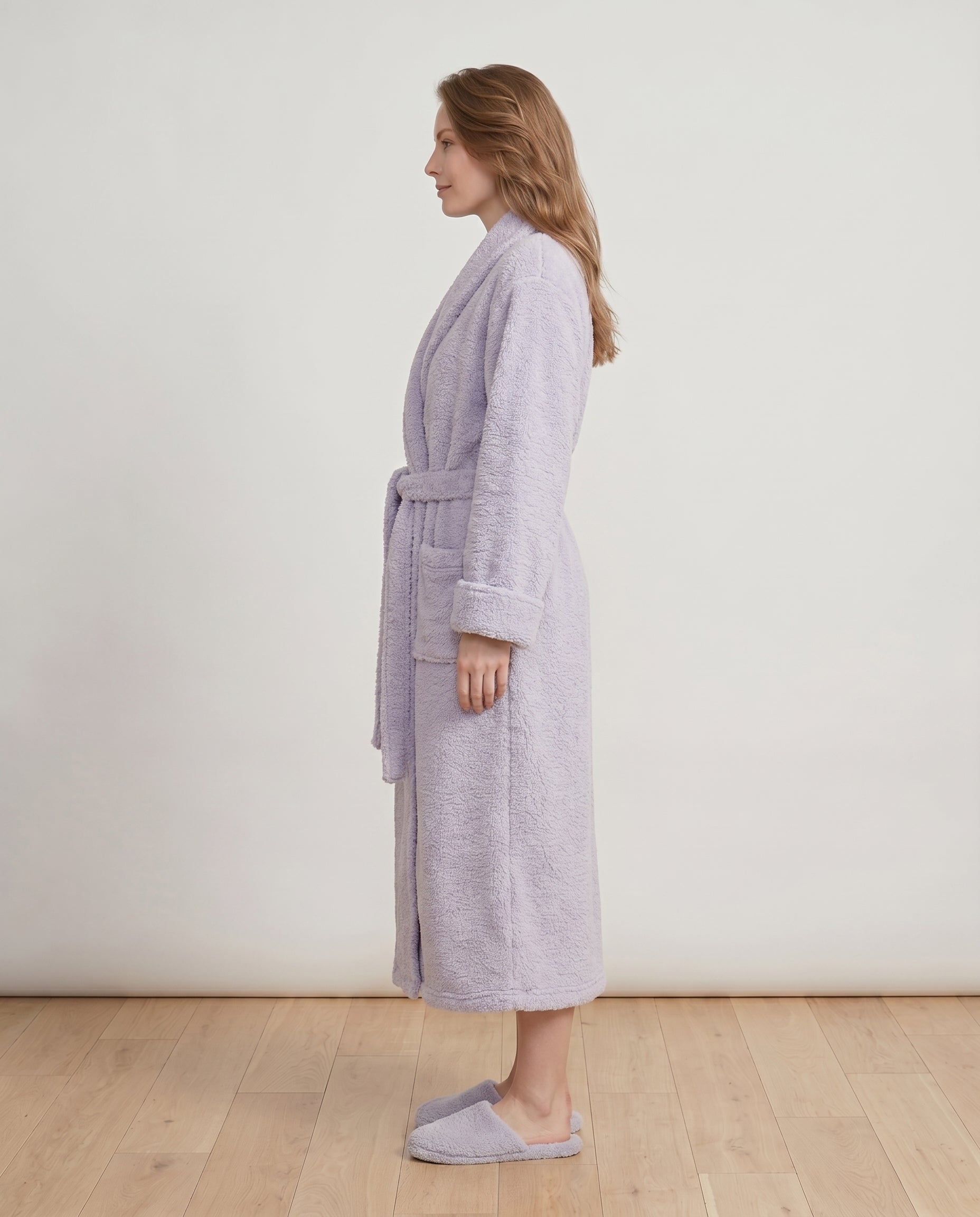 Woman wearing a lavender plush robe for a women's robe style comparison